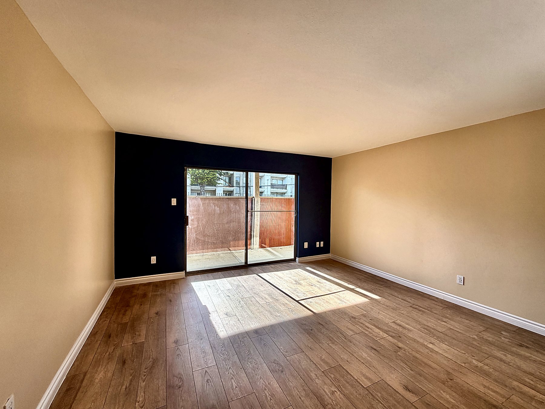 Living room with full-height sliding doors to the balcony